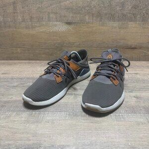 The Olukai Mio Li athletic shoes in grey leather/mesh are designed for men in si